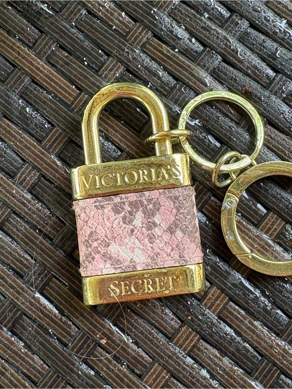 Victoria's Secret padlock keychain features a rose gold finish and a pink snakes